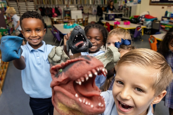 Kindergarteners playing with creatures